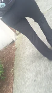 Girl with a nice ass in leggings walking down the street