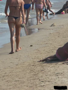 Bunch of sexy babes at the beach in thong bikinis