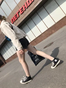 Cute candid teen with pale slim legs in shorts
