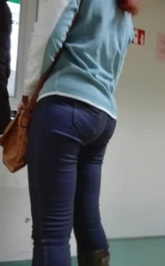 Wide ass on a redhead in tight jeans