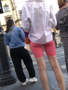 Awesome booty in spandex shorts, candid girl on a sidewalk