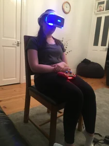 Candid Teen in White Socks And Yoga Pants Sitting With a VR Headset On