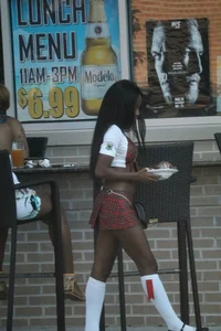 Sexy ebony Tilted Kilt employee in her uniform