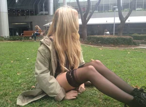Skinny Blonde Teen Sitting on the Lawn in Black Stockigs Cute Candid Photo