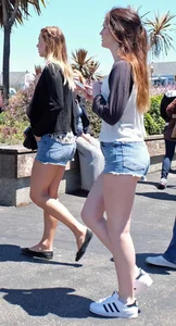 Cute girl walking in short jean shorts