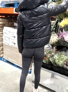 Girl in leggings with a perfect ass and slim legs picking flowers at the supermarket creepshots