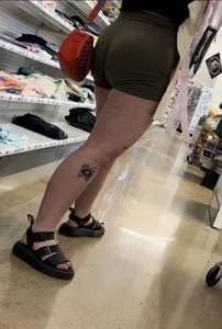 Juicy brunette in green spandex shorts OC