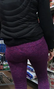 Milf shopping with a nice ass in purple leggings