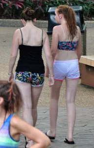 Couple of cute girls in wet shorts with decent asses