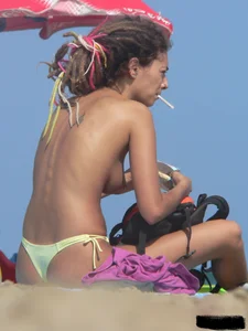 Sexy girls going topless at the beach showing off their sexy bodies