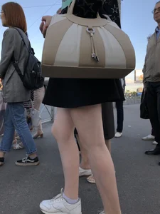 Candid girl wearing a short skirt crossing the street, awesome pale legs