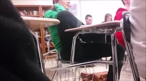Girl sitting oddly in class with leggings on