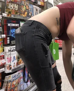 Latina in Maroon crop top and tight black jeans