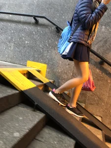 Girl With Skinny Legs in Pahtyhose and a Skirt Walking Down the Stairs Street Candid Gallery