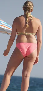 Thick blonde bikini babe on the beach