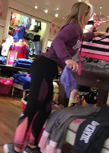 Pink employee with a perfectly round ass in leggings