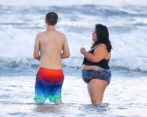 Extra thick girl at the beach in a bikini