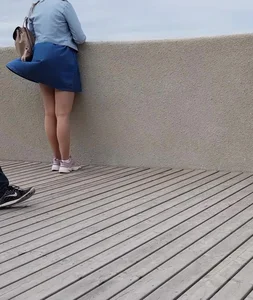 Wind jerking up candid milf's skirt