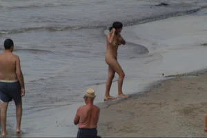 Girls on a nude beach in Sitges, Spain