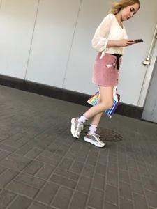 Cute street candid girl in a skirt
