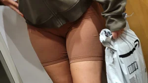 Close up Cameltoe in Brown Shorts with Amazon Package in Hand