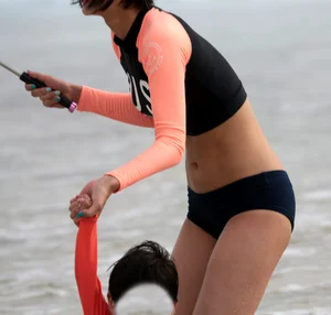 Skinny Asian milf on the beach with sexy body