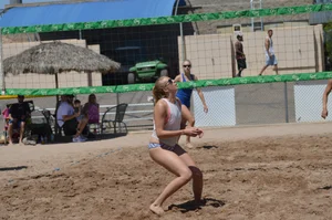 Beach volleyball blonde looking sexy and showing her body off