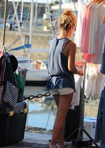Sexy blonde girl in short white shorts