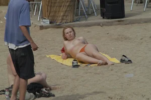 Topless girls on a beach in Barcelona