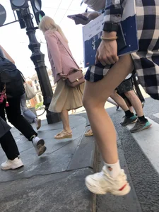 Nice legs of a candid girl crossing the street