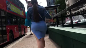 Candid babe with a monster booty in a tight little blue skirt