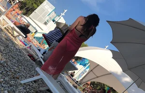 Sexy girl at the pool in pink bikini