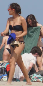 Two thick white girls in bikinis on the beach with big asses