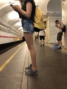 Cute Skinny Teen in Jean Mini Shorts Standing on the Subway Platform
