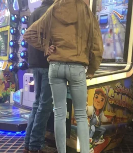 Skinny teens in the arcade