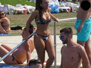 Sexy girl at the pool with a nice ass in thong bikini