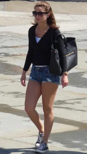 Cute girl with nice legs in short denim shorts