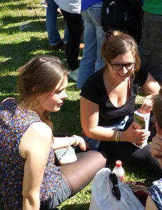2 sexy girls showing nice cleavage while sitting together