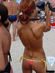 Beach voyeur girls in bikinis, thongs and topless