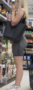 Beauty blonde in tight shorts with juicy fat ass