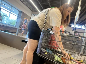 Milf in black biker shorts and flip flops