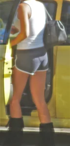 Skinny babe going to her car in little cotton shorts