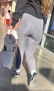 Sexy girl in grey leggings showing ass and cameltoe