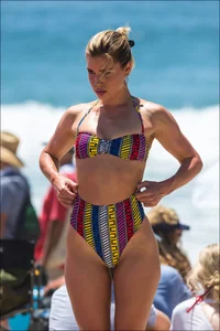 Beach girl with an incredible body in a funky looking bikini