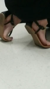 Feet in Sandals Creep Closeup Photo