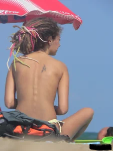 Sexy girls going topless at the beach showing off their sexy bodies