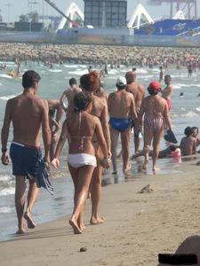 Bunch of sexy babes at the beach in thong bikinis