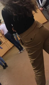 Candid teen student wearing tight pants, wavy hair and skinny ass