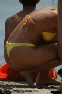 Beach voyeur girls in bikinis, thongs and topless
