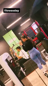 Girl in yoga pants gym video selfie in the mirror